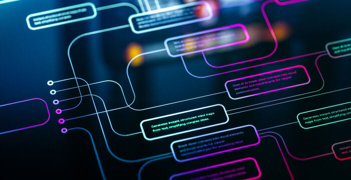 Abstrakte Nahaufnahme eines digitalen Netzwerks: Leuchtende, bunte Chat- bzw. Textblasen (Blau, Türkis, Pink) sind durch kurvige Linien miteinander verbunden, vor dunklem Hintergrund; wirkt wie eine Visualisierung von Kommunikation oder Datenfluss.